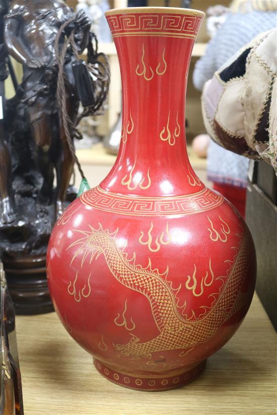 A Chinese red ground dragon vase